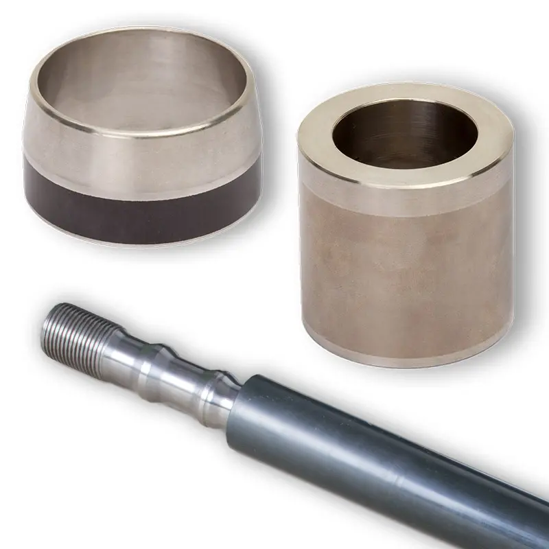 Deutsch: Abbildung zeigt beschichtete Wellenschonhülsen und einen Beschichteten Plunger English: Picture displays coating on different shafts and other mechanical parts